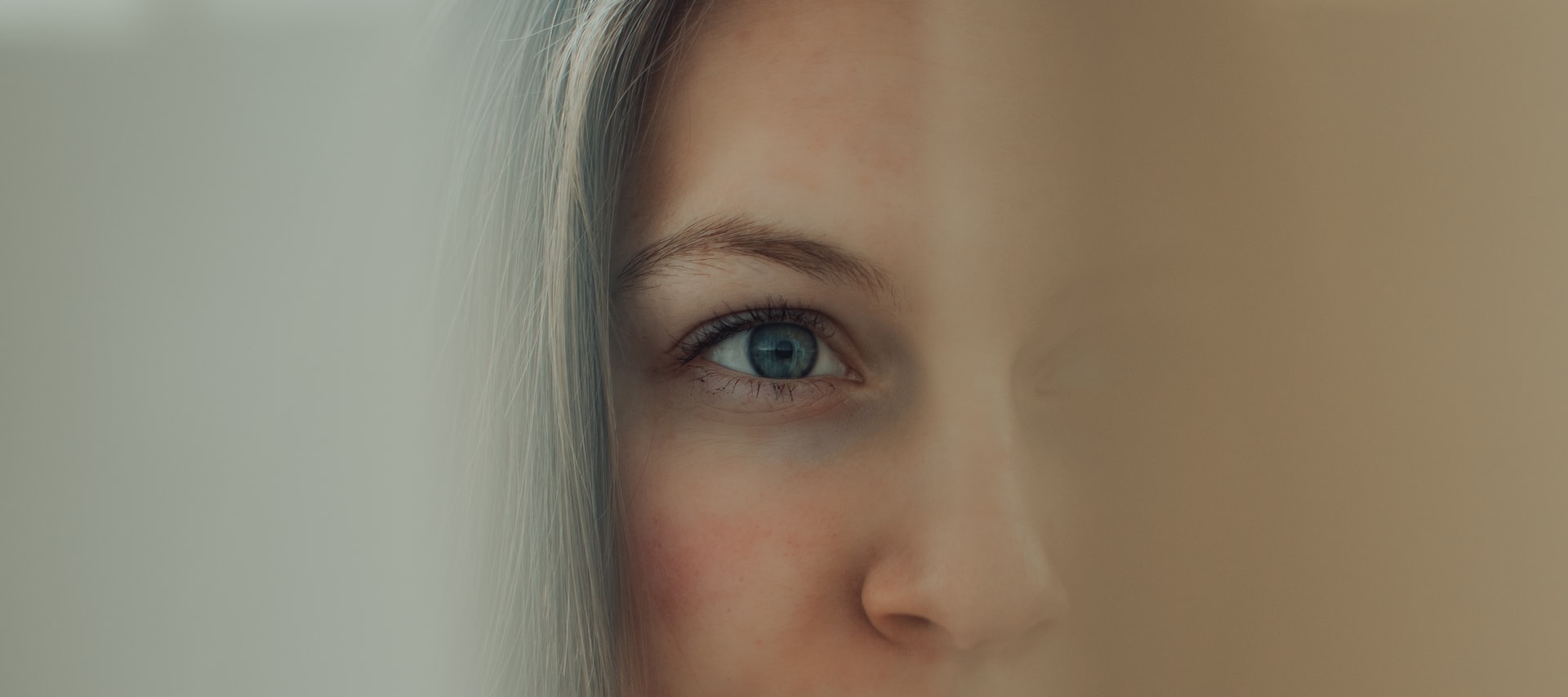 a close up of a woman's face with a blurry background